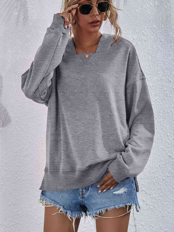 Dropped Shoulder Slit Hoodie Trendsi